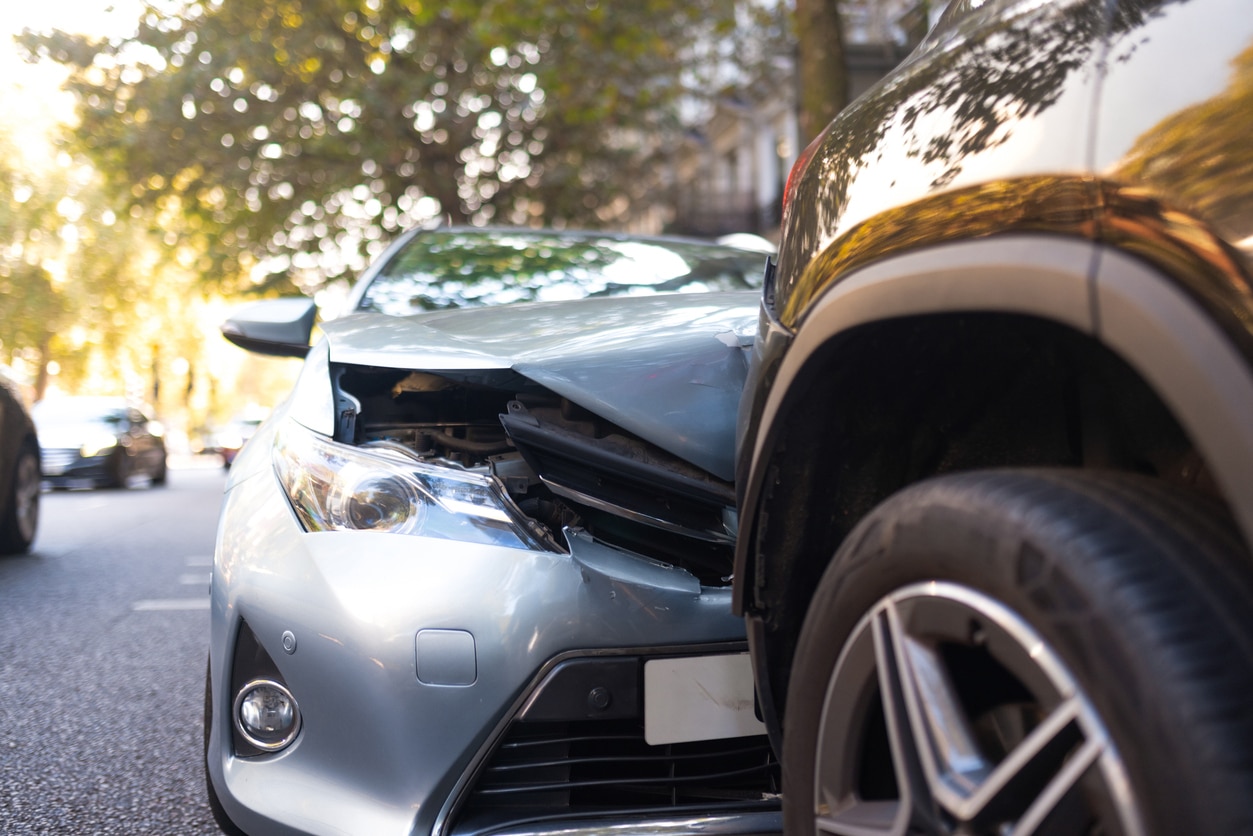 Car accident involving two vehicles on a street.